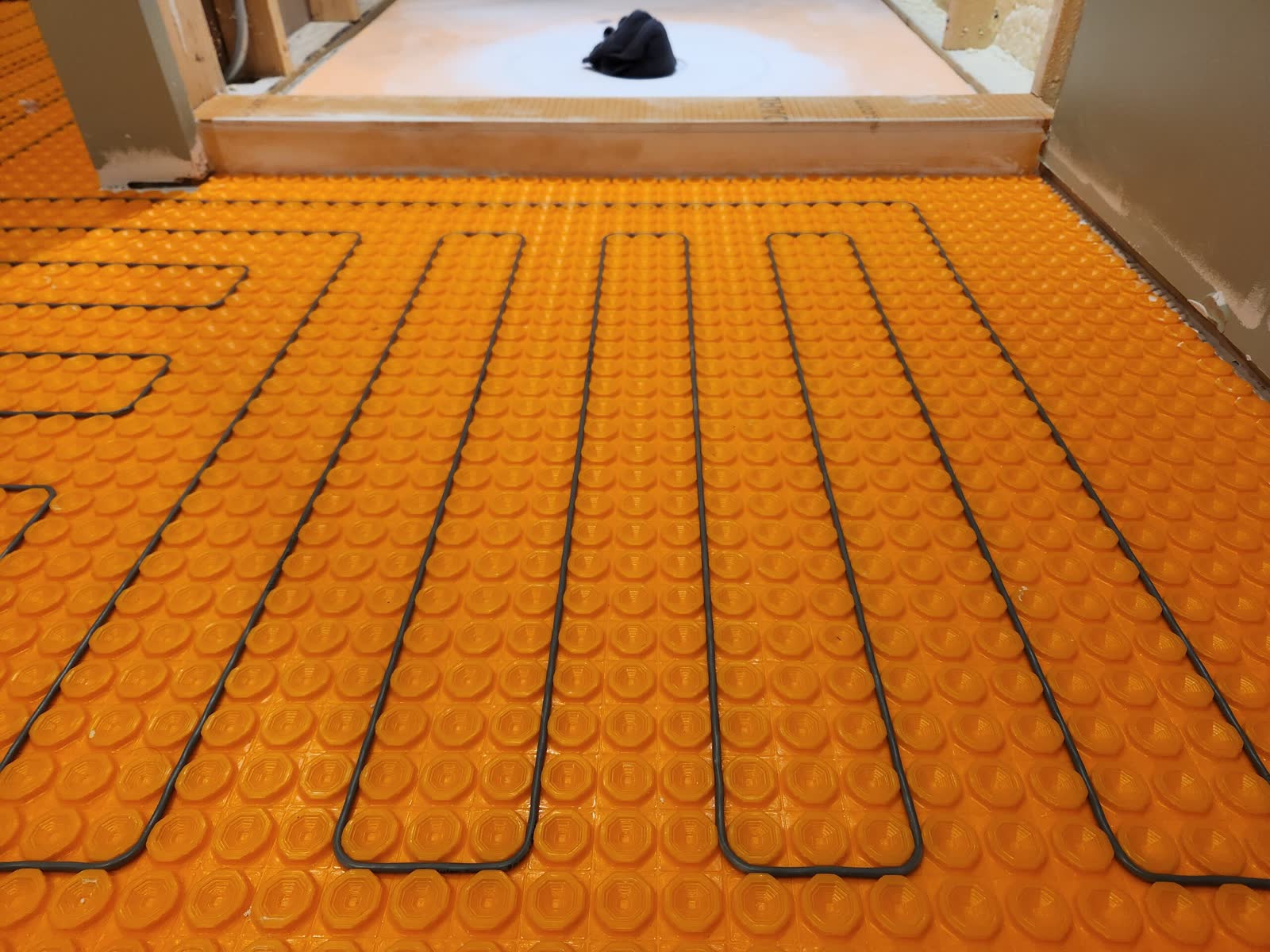 Ditra heat radiant floor system winter construction custom bathroom maine