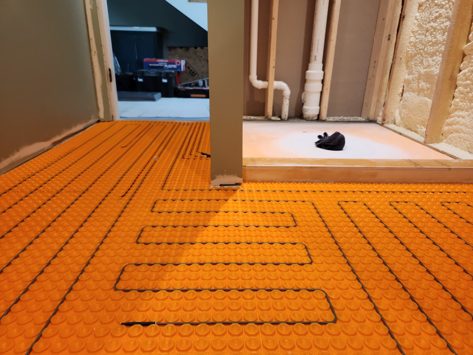 Radiant heated floor installation winter construction custom bathroom maine