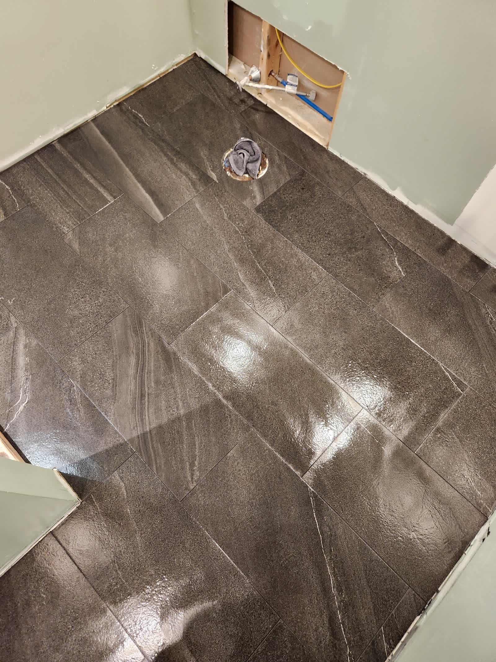 Slate floor tile progress winter construction custom bathroom maine
