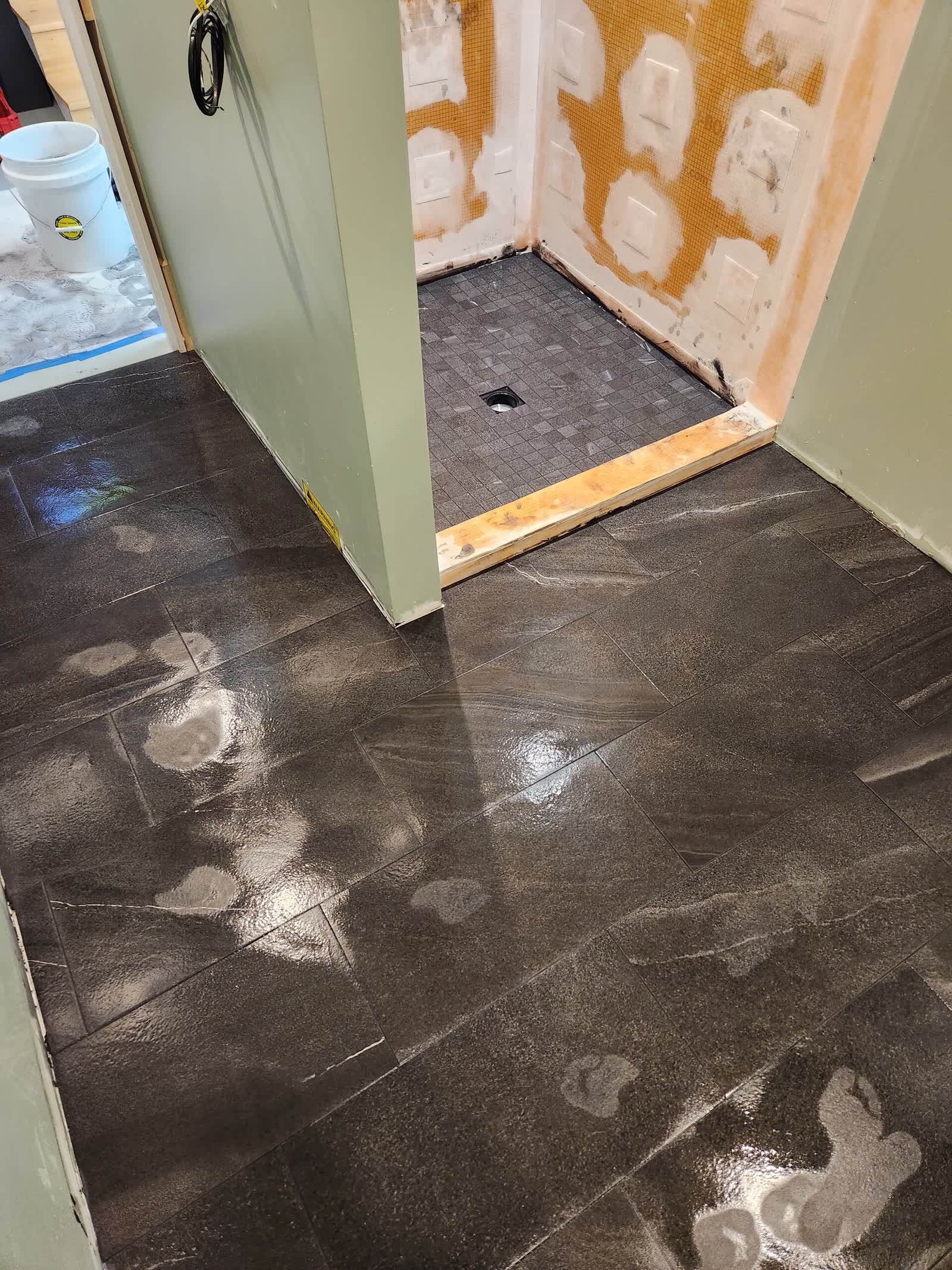 Charcoal slate floor tile winter construction custom bathroom maine