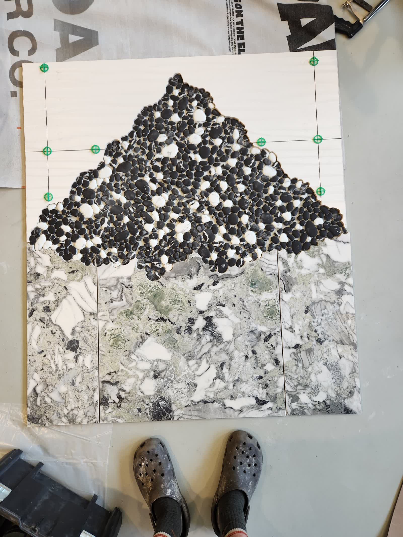 Custom pebble mosaic installation winter construction custom bathroom maine
