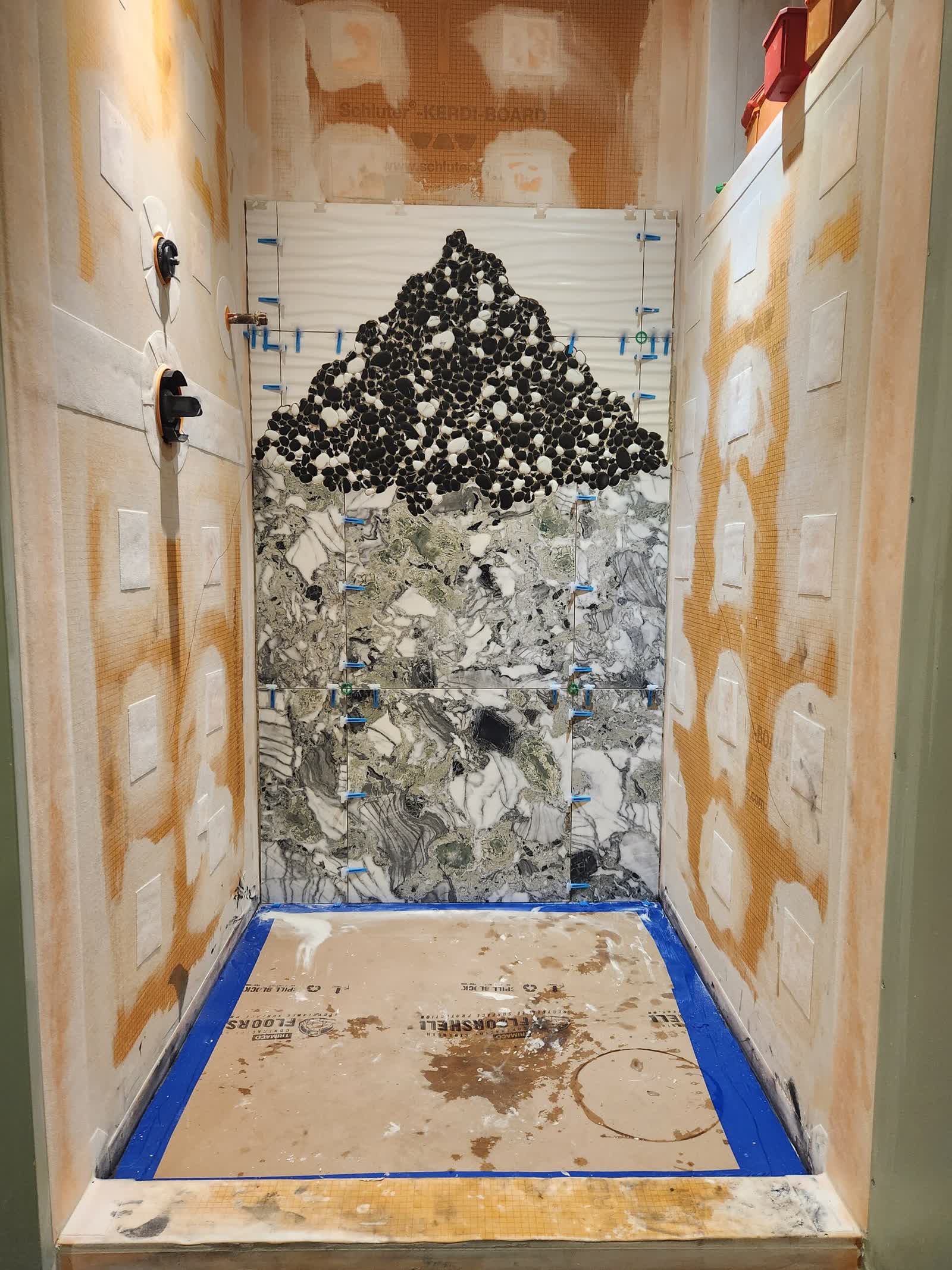 Mosaic feature wall progress winter construction custom bathroom maine