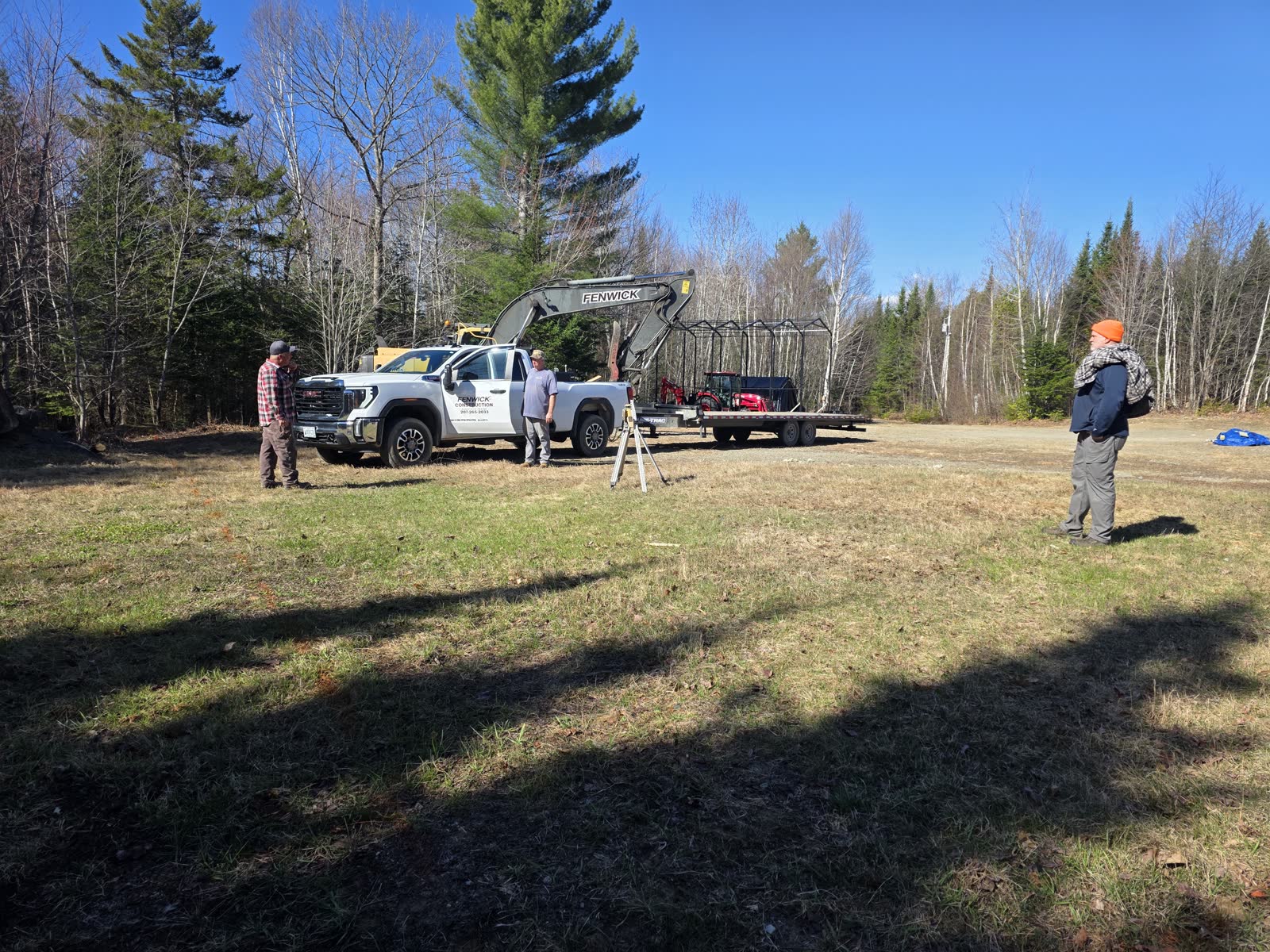 Equipment arrives at the lot at a Winter Construction garage build in Western Maine