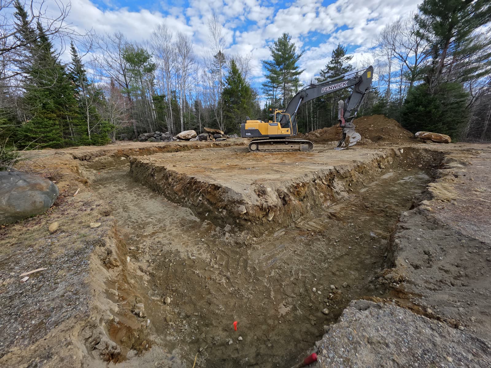 Footing trenches cut at a Winter Construction garage build in Western Maine