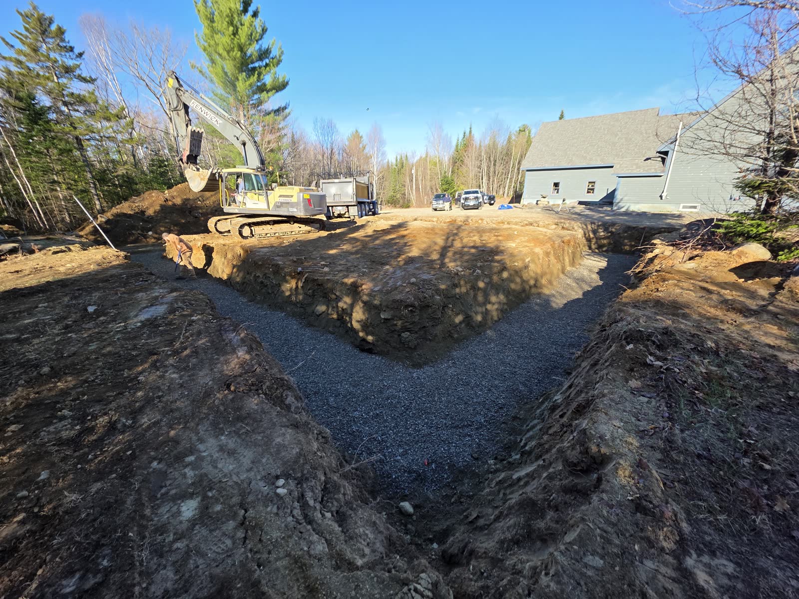 Footings graveled and leveled at a Winter Construction garage build in Western Maine