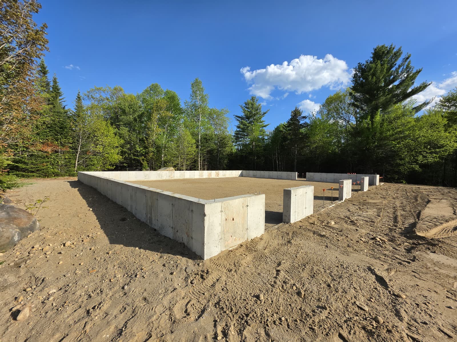 Forms stripped, foundation complete at a Winter Construction garage build in Western Maine