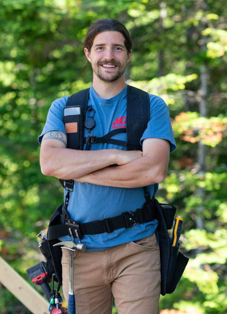 John Winter, owner and custom home builder at Winter Construction Company, on a job site in the Western Maine mountains