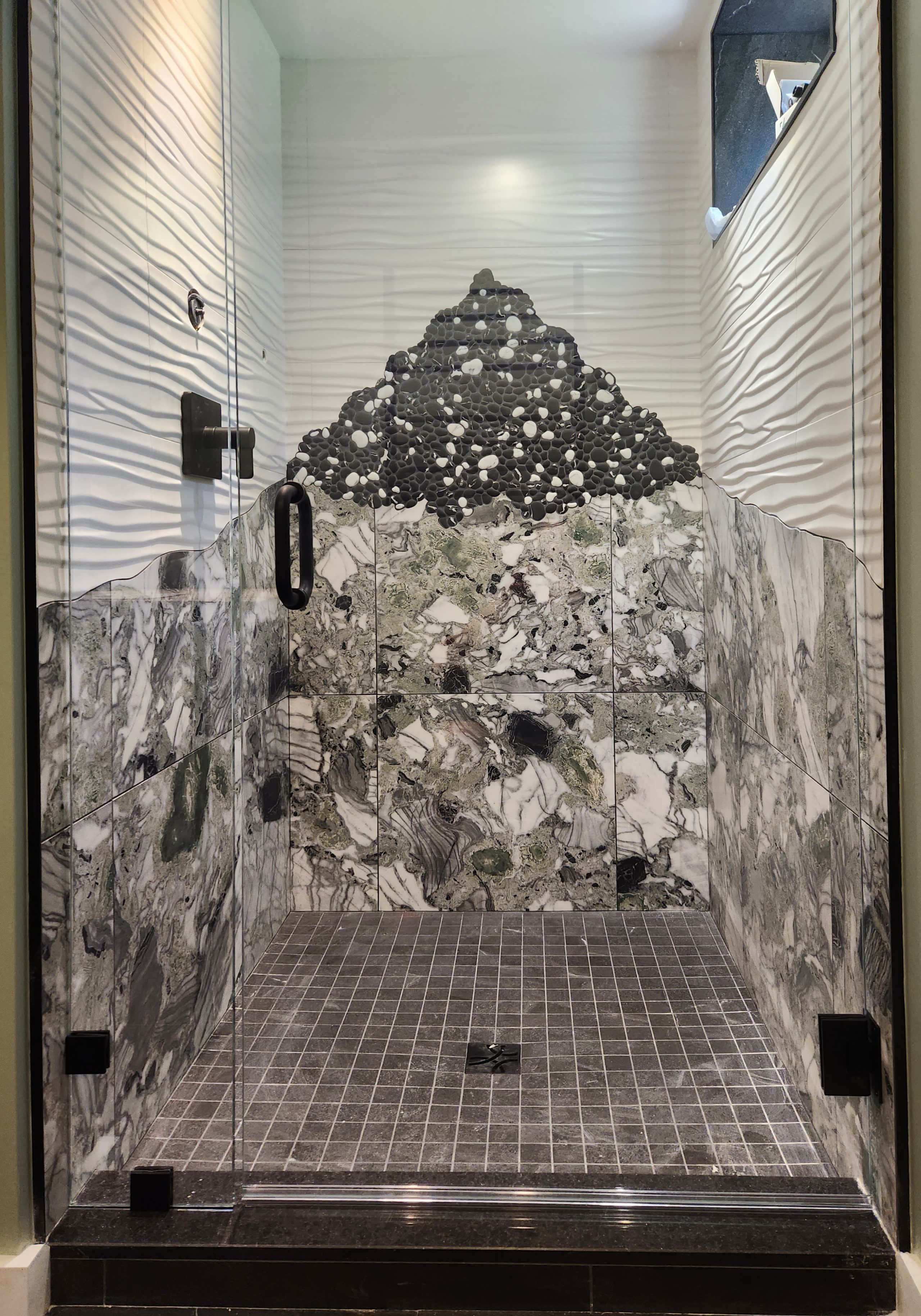 Pebble mosaic marble shower tile finish work winter construction maine