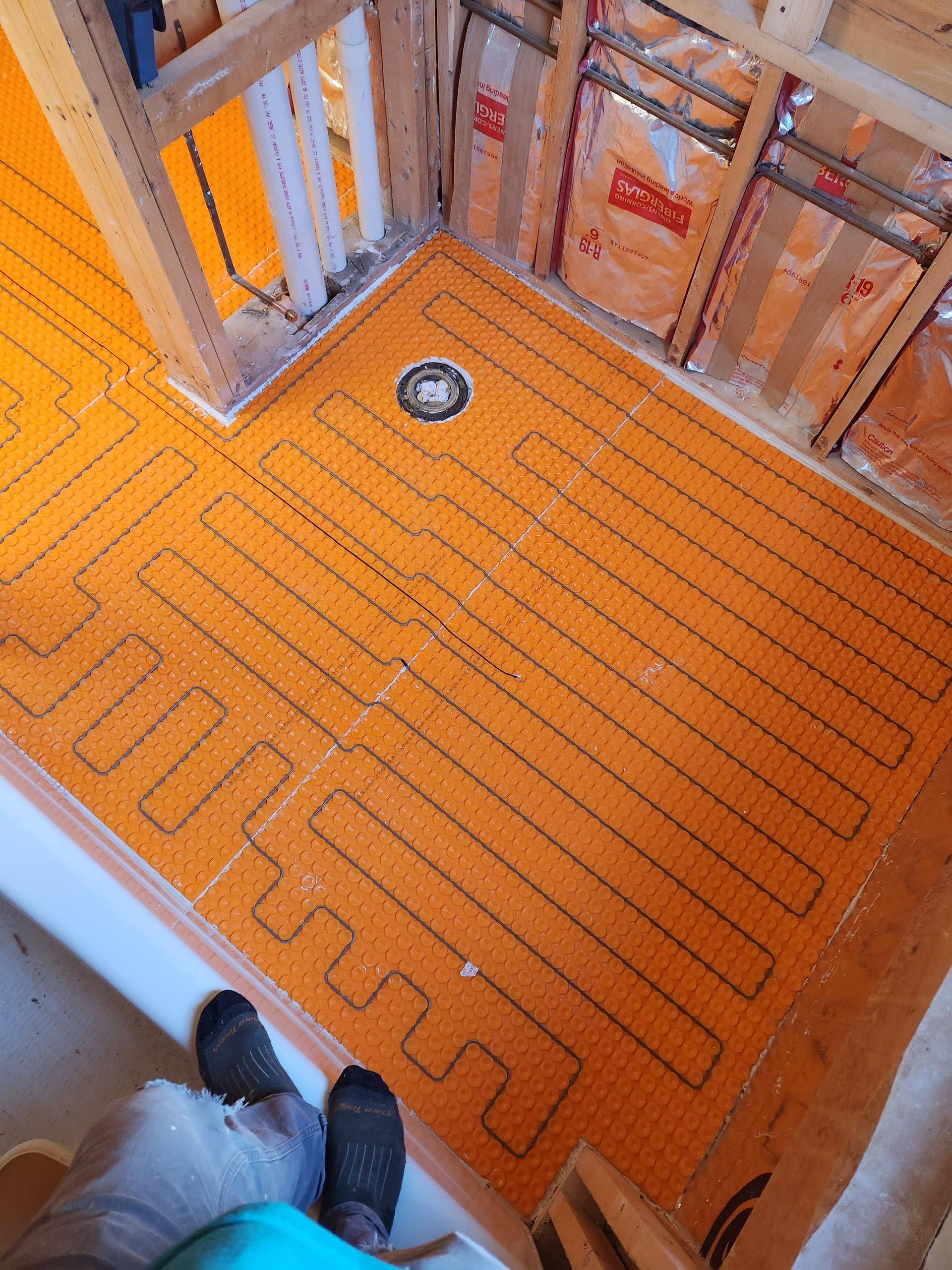 Ditra heat radiant floor membrane winter construction bathroom remodel maine