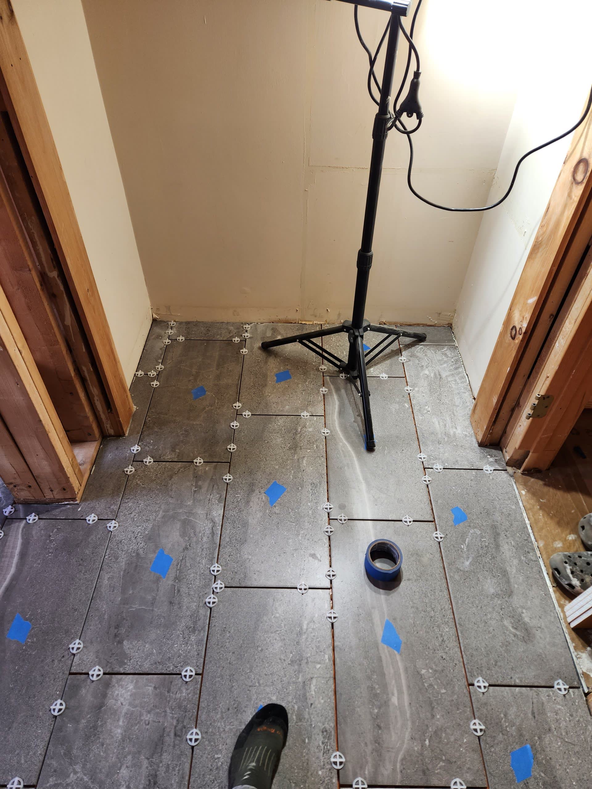 Bathroom floor tile installation winter construction bathroom remodel maine