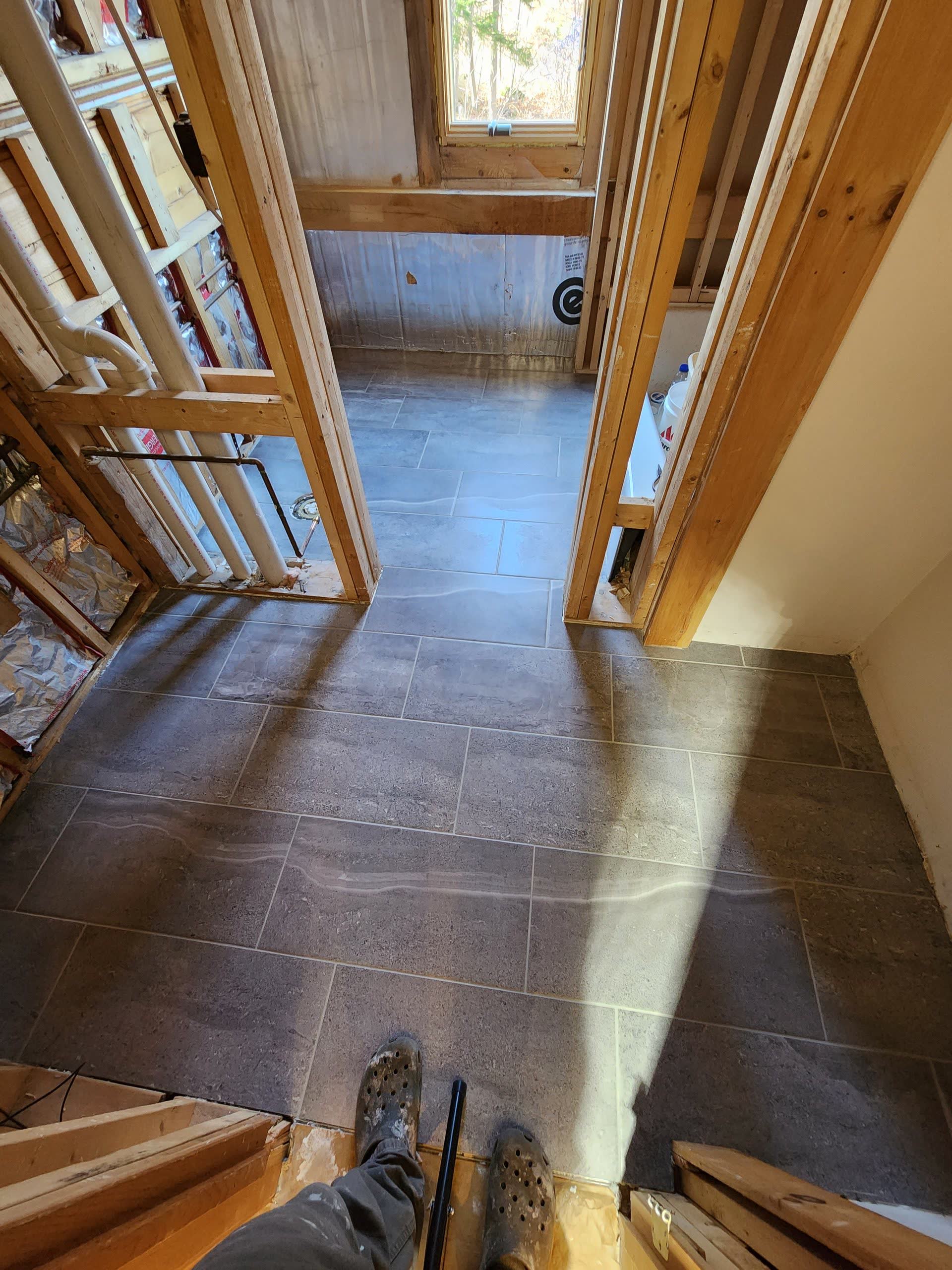 Finished bathroom tile floor winter construction bathroom remodel maine