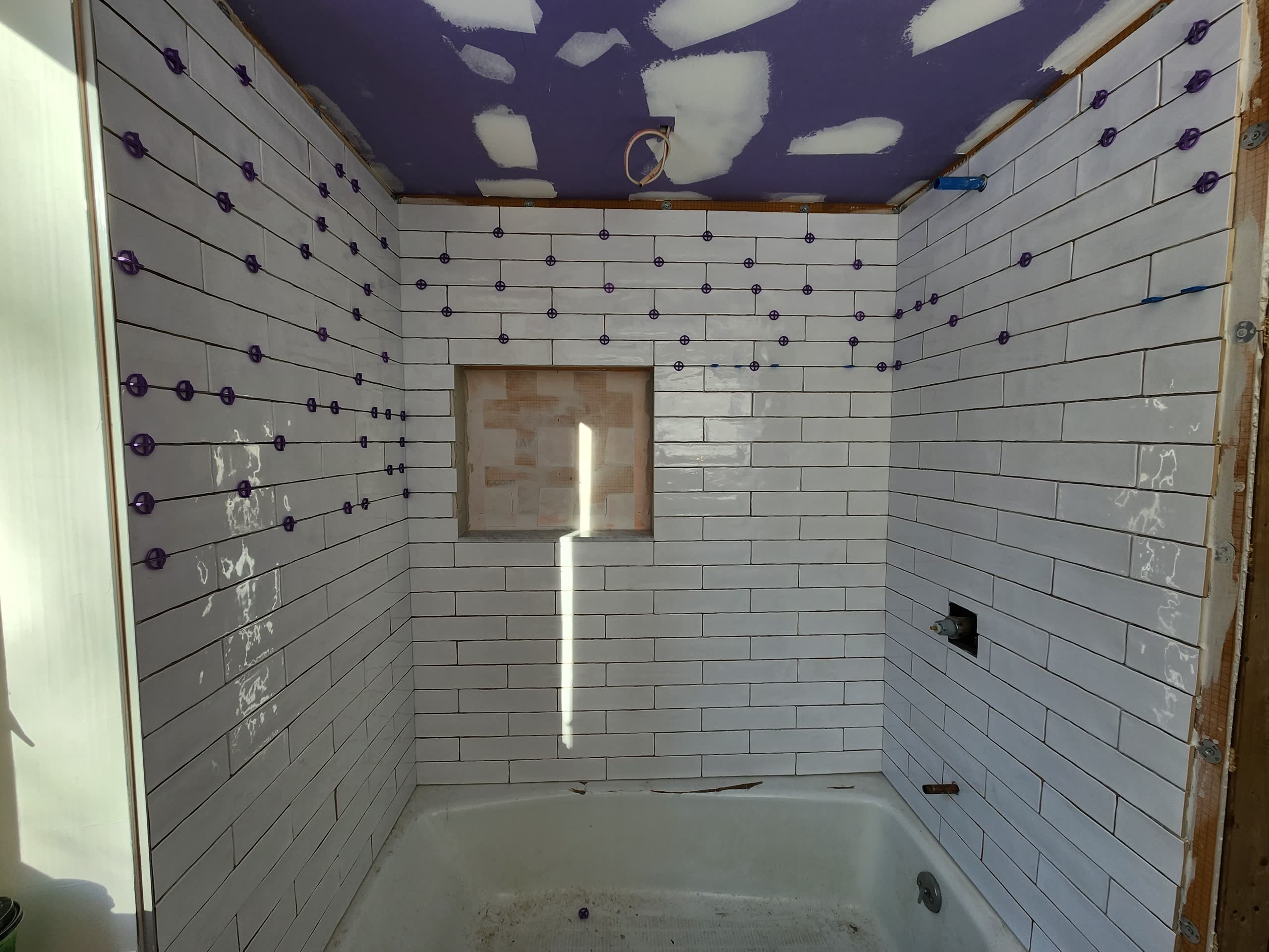 Subway tile shower niche winter construction bathroom remodel maine