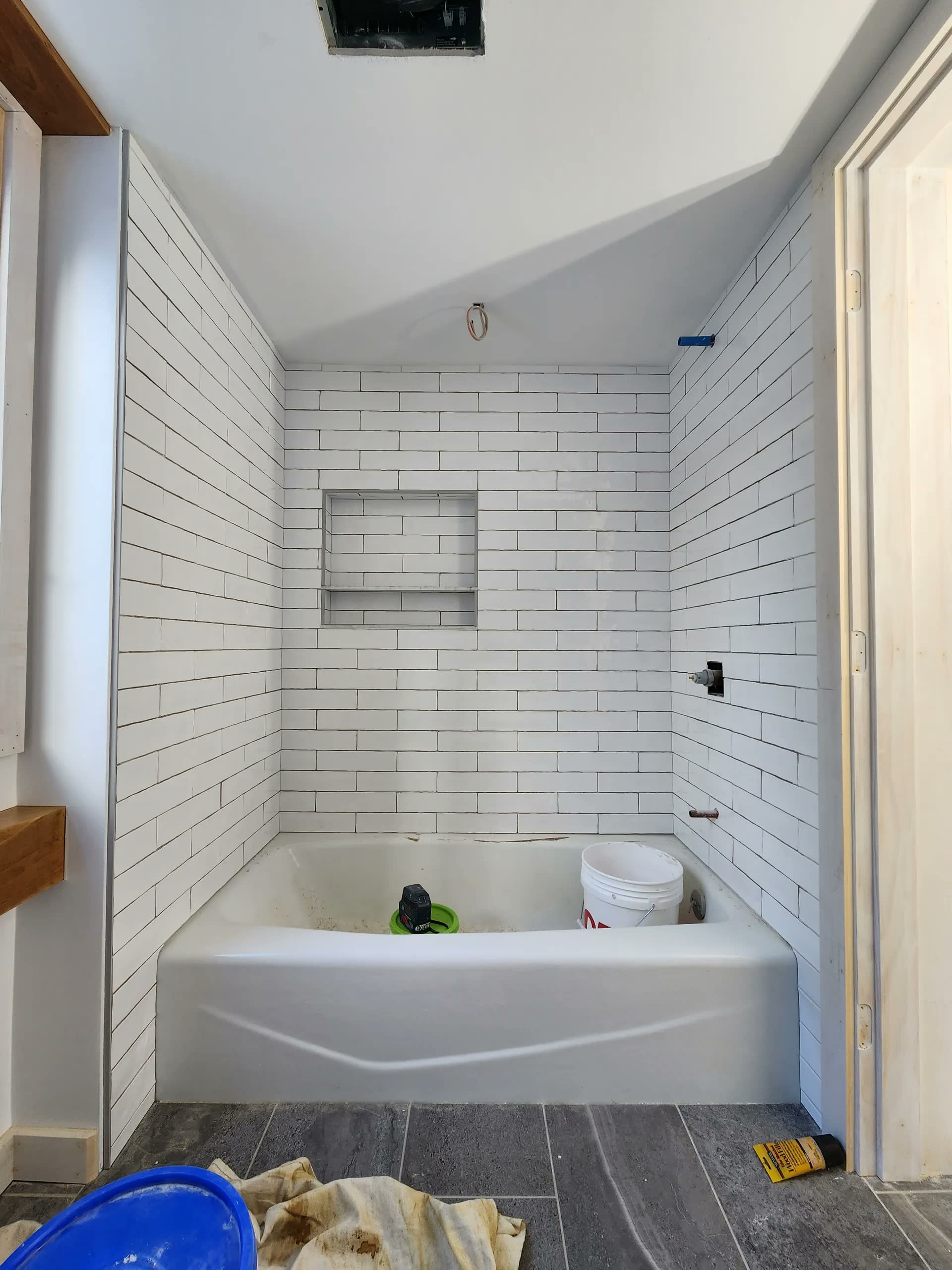Finished tiled tub surround winter construction bathroom remodel maine