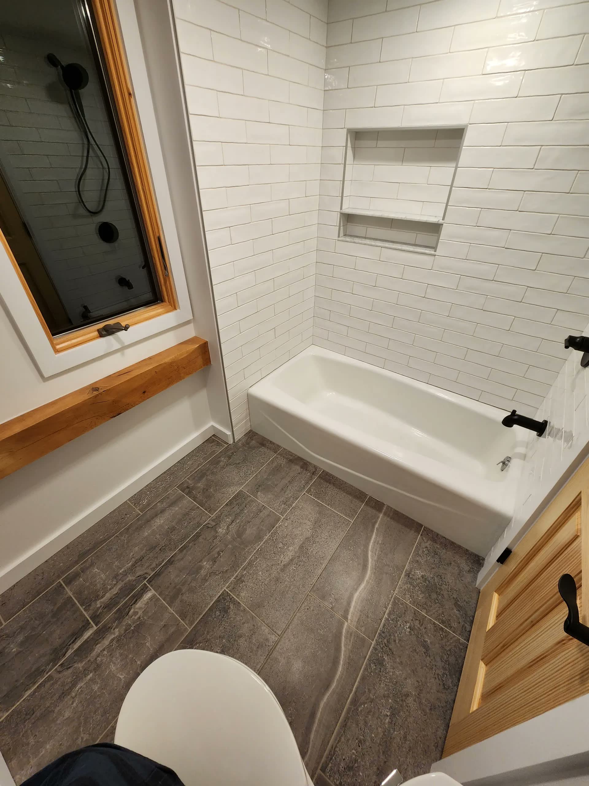 Tiled tub surround window winter construction bathroom remodel maine