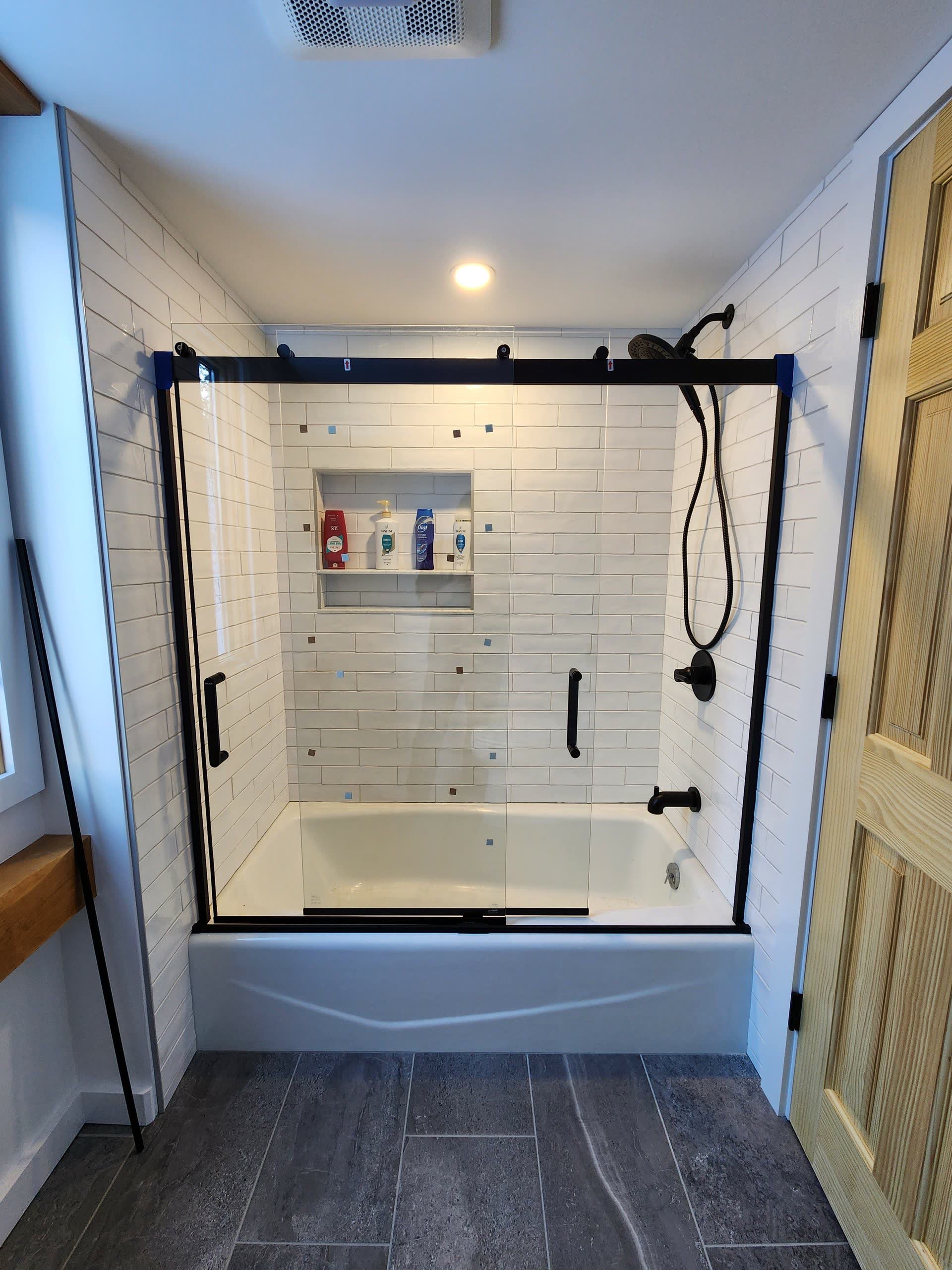 Glass shower enclosure winter construction bathroom remodel maine