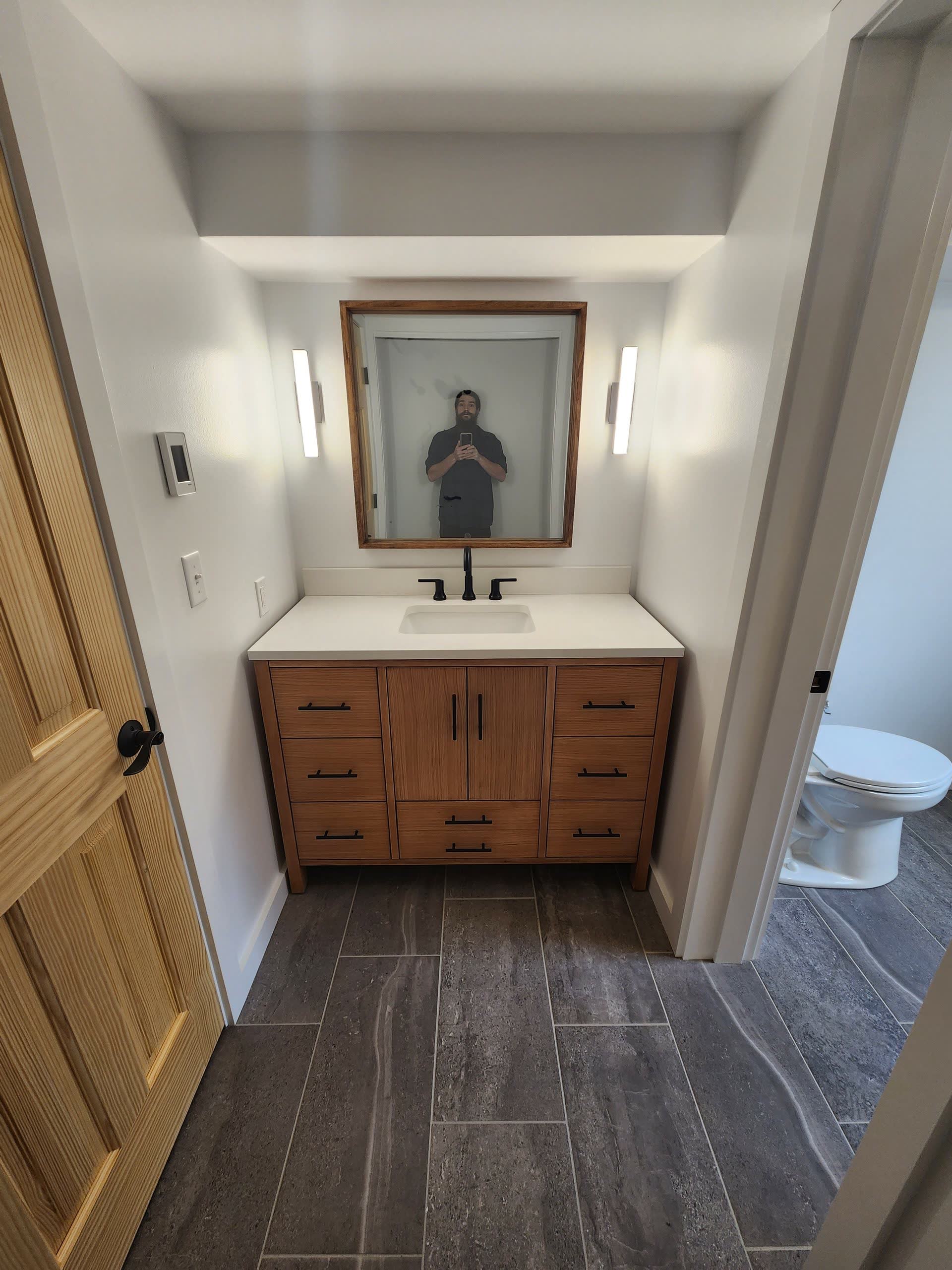 Vanity sconce lighting winter construction bathroom remodel maine