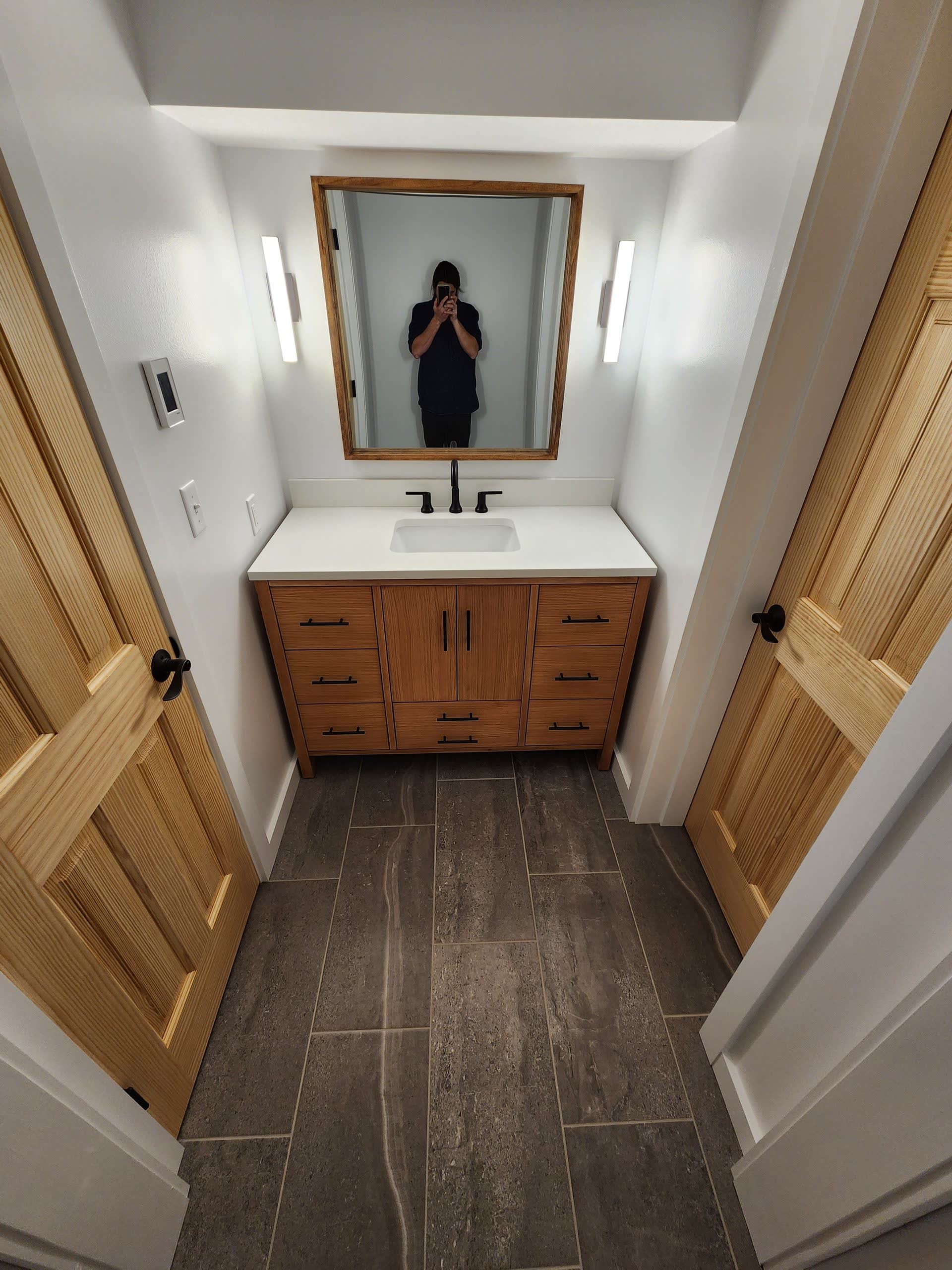 Wood vanity tile floor winter construction bathroom remodel maine