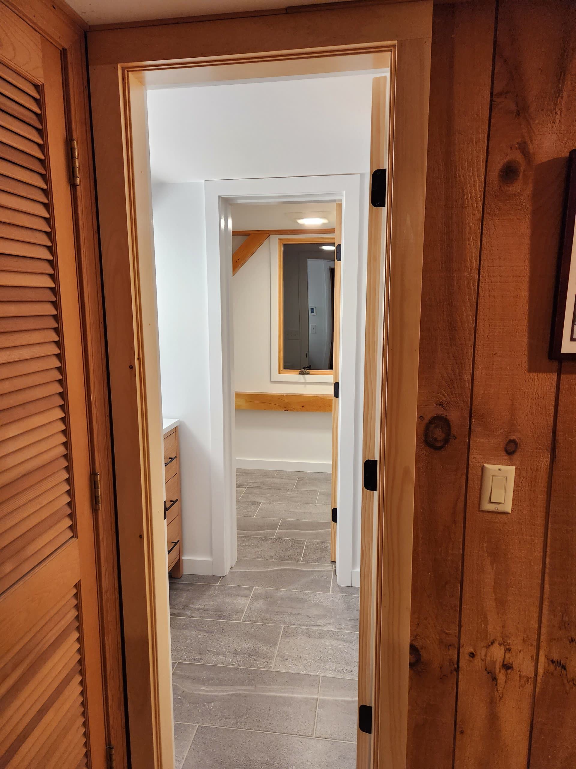 Finished bathroom from hall winter construction bathroom remodel maine