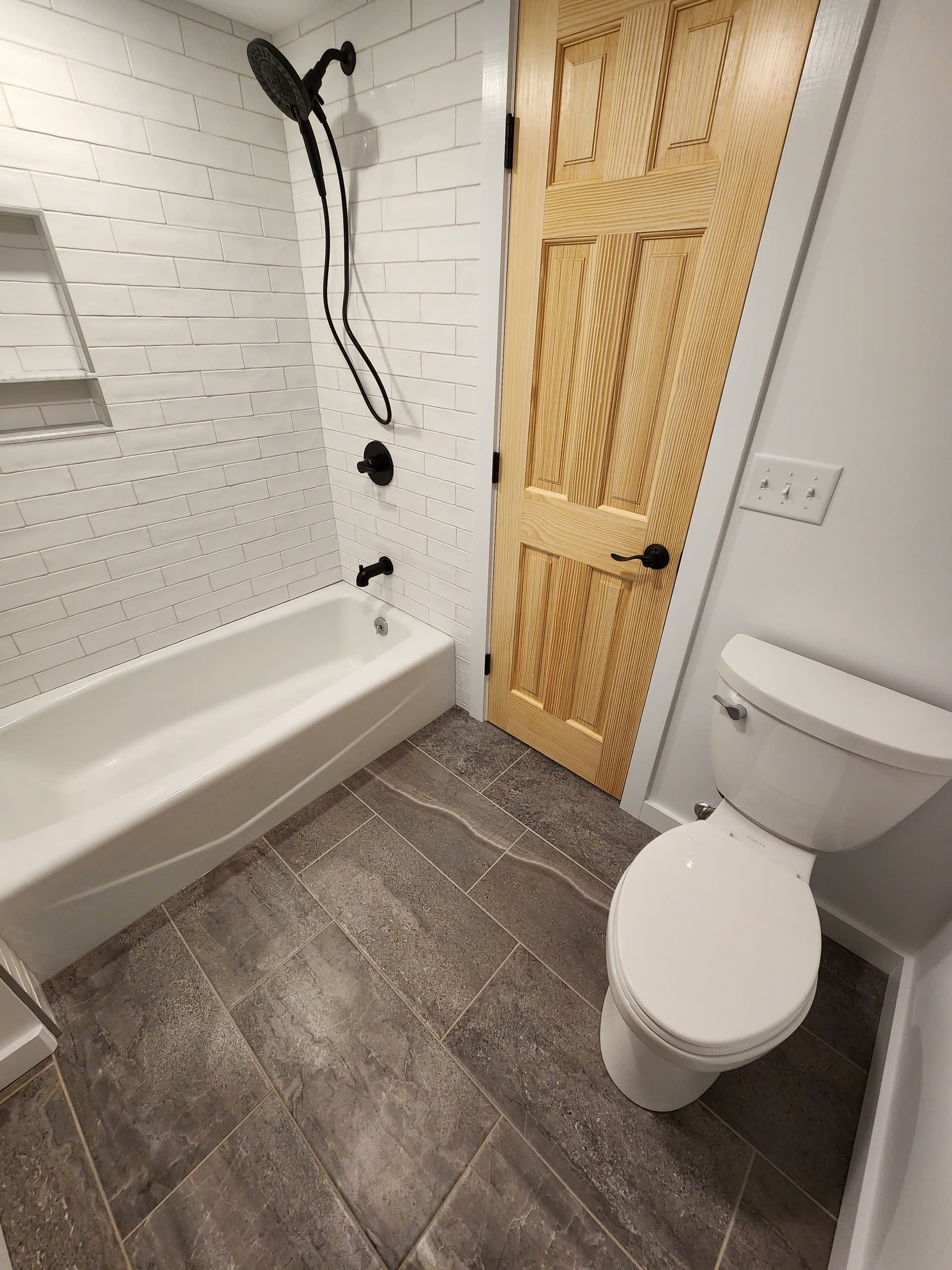 Finished shower and toilet winter construction bathroom remodel maine